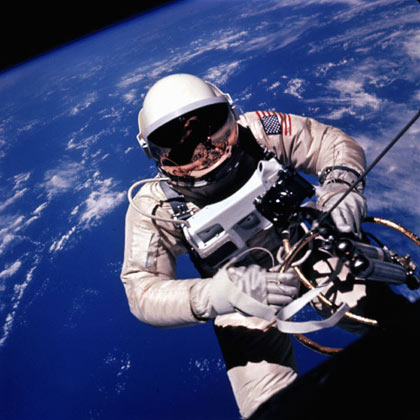 Ed White backs away from the Gemini spacecraft over the Pacific Ocean northeast of Hawaii