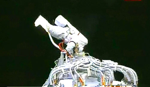 Chinese astronaut Zhai Zhigang conducts China's first spacewalk outside the Shenzhou VII spacecraft