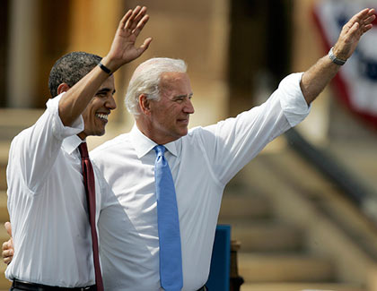 Democratic presidential candidate Sen. Barack Obama, D-Ill., and his vice presidential running mate Sen. Joe Biden, D-Del., wave to supporters outside the Old State Capitol on Saturday, Aug. 23, 2008, in Springfield, Ill.