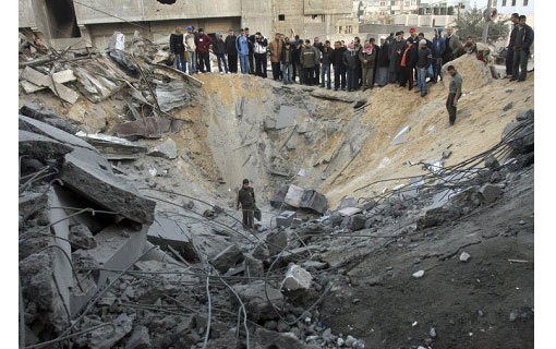 a bomb leaves a huge crater in the middle of the city