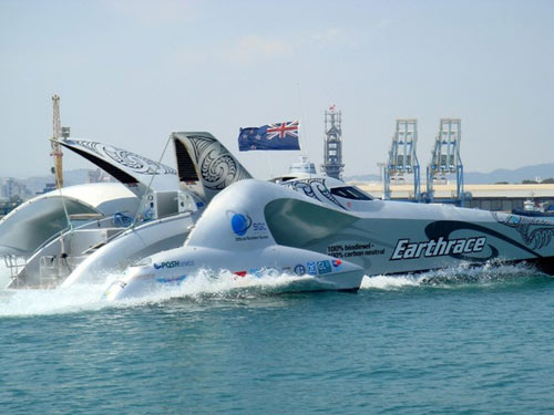 Biofuel-powered Earthrace has smashed the world circumnavigation record for a speedboat by almost 14 days