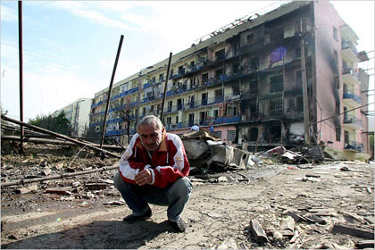 Georgian man amid the rubble of a destroyed street in the town of Gori. Georgian officials said that over the weekend Russia had expanded its attacks on Georgia, moving tanks and troops through South Ossetia and advancing toward the city of Gori in the center of the country.