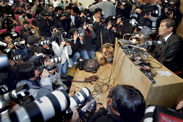 Humiliation: At a packed Dec. 16 press event, Hwang withdrew a key research paper