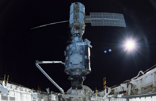 In December 1998, the crew of Space Shuttle Mission STS-88 began construction of the International Space Station - Astronaut James Newman is seen here making final connections the U.S.-built Unity node to the Russian-built Zarya module