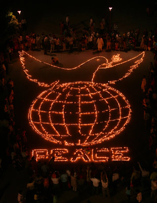 members of the All India Anti-Terrorist Front (AIATF) light earthen lamps assembled to form the word peace on the eve of Diwali in the northern Indian city of Chandigarh, Oct. 27, 2008