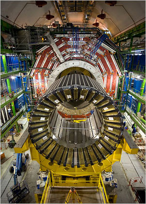 the Large Hadron Collider, a massive particle detector, in its cavern below France