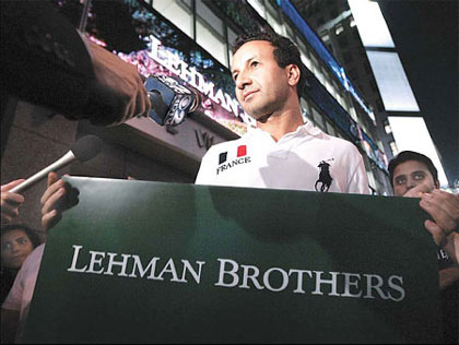 Mo Grimeh, a Lehman Brothers managing-director who has worked with the company for 10 years, walks out of his office building in New York on Sunday Mo Grimeh, a Lehman Brothers managing-director who has worked with the company for 10 years, walks out of his office building in New York on Sunday
