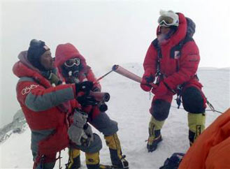Olympic Torch lit on top of Mount Everest