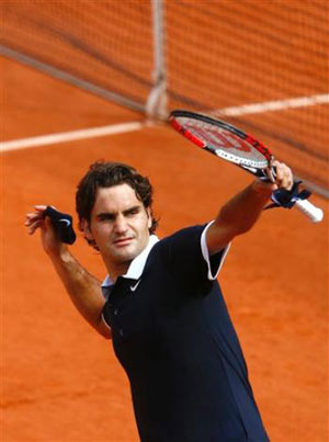top seeded Switzerland's Roger Federer defeats France's Julien Benneteau in French Open at the Roland Garros stadium in Paris