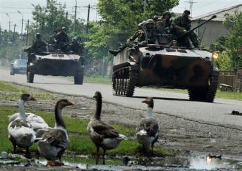Russian troops ride on armored vehicles during a search operation outside of the Black Sea port of Poti, Georgia Russian troops ride on armored vehicles during a search operation outside of the Black Sea port of Poti, Georgia