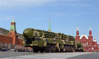 Russian truck-mounted Topol intercontinental ballistic missiles roll in the annual Victory Day parade