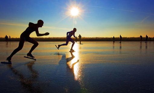 skaters compete on track of ice in northern Dutch province of Frieslands
