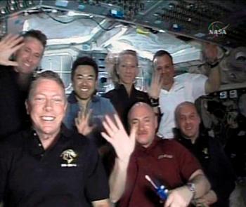 crew of shuttle Discovery: Mike Fossum, Mark Kelly and Garrett Reisman; Ken Ham, Akihiko Hoshide, Karen Nyberg and Ron Garan