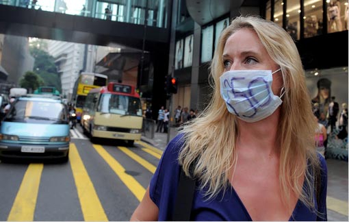 A woman in Hong Kong's central district. In a campaign organized by the environmental movement 350.org, activists are pressing the world's leaders to reach a climate change accord at talks in Copenhagen in December.