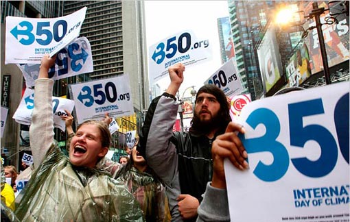 Kathleen Jordan, of New York, left, and others participate in an International Day of Climate Action rally on Saturday in New York's Times Square.