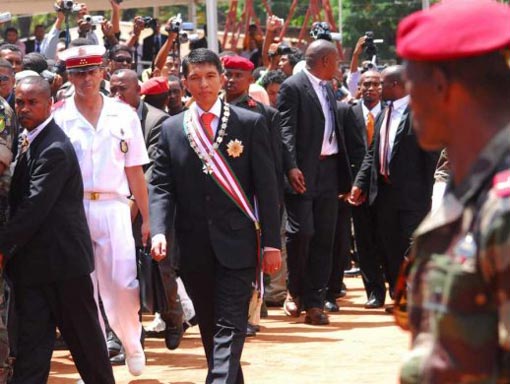 Madagascar President, Andry Rajoelina (C) walks past military personnel after being sworn in in Antananarivo, Madagascar, 21 March 2009. Tens of thousands of his supporters attended the ceremony at a sports arena in the capital, Antananarivo, but it was boycotted by many diplomats