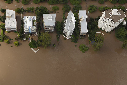 Apartment towers on the Brisbane riverfront surrounded by water on January 13 2011
