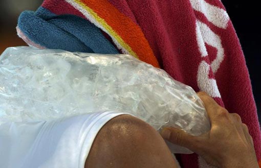 Zvonareva cools down with an ice pack during her match against Bartoli at the Australia Open