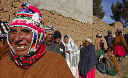 Aymara Indians line up to vote at a polling station in Walata Chico, Bolivia, Sunday, Jan. 25, 2009. Bolivians are voting on proposed changes to their constitution, aimed at remaking the country on behalf its indigenous majority and allowing Morales to run for a second consecutive five-year term