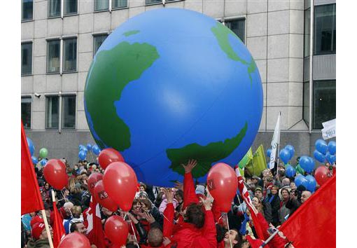 protesters play with an inflatable globe as they march downtown during a climate change demonstration in Brussels December 5, 2009 protesters play with an inflatable globe as they march downtown during a climate change demonstration in Brussels December 5, 2009