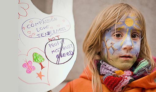 6-year-old Daci holds a placard as she participates in ‘The Wave’ demonstration supporting action on climate change as the march begins through central London. Organized by the Stop Climate Chaos Coalition, the protest aims to highlight public concern ahead of the UN climate summit in Copenhagen.