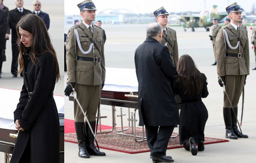 daughter of President Lech Kaczynski, Marta, and his twin brother Jaroslaw Kaczynski pay their respects in front of his coffin