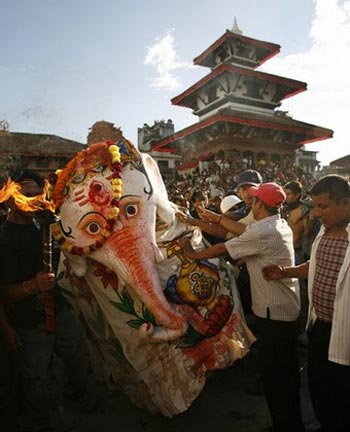 devotees dressed up as an elephant god perform rituals during the Indrajatra festival in Kathmandu September 14, 2008 devotees dressed up as an elephant god perform rituals during the Indrajatra festival in Kathmandu September 14, 2008