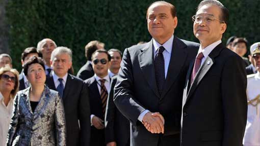 Italian Premier Silvio Berlusconi, shakes the hand of Chinese Premier Wen Jiabao, right, as they arrive for a joint news conference at Villa Madama in Rome