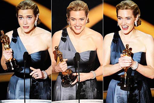 Kate Winslet accepts the award for best actress in a leading role for her performance in The Reader