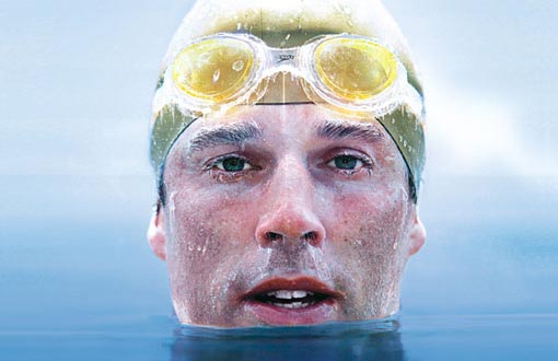 In only a Speedo and a silicone cap, Pugh had swum an entire kilometer among the great icebergs of the Antarctic and repeated the distance at the top of the world too.
