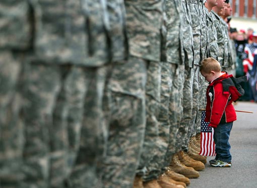 3-year-old boy saying goodbye to father who was being deployed