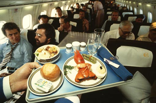 A passenger gets set for a lobster dinner on board. Concorde could never be called a cheap way to fly, but you were able to beat time itself by arriving in New York an hour earlier than you left London, and enjoy some fine dining in the process. The food was served on Wedgwood crockery with short silver cutlery.