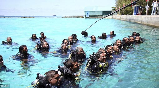 The ministers surfaced to speak to the media in their scuba gear the ministers surfaced to speak to the media in their scuba gear