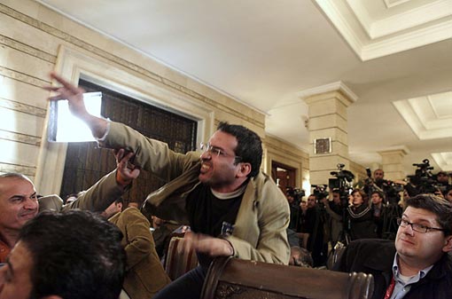 On December 14, Muntazer al-Zaidi, a television journalist attending a press conference with President Bush and Iraqi Prime Minister Nouri al-Maliki, threw both of his shoes at the U.S. President. As he threw the shoes, he shouted, ‘This is a gift from the Iraqis; this is the farewell kiss, you dog!’