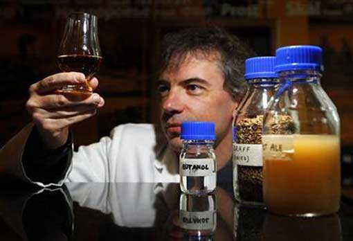 Professor Martin Tangey, Director of Edinburgh Napier University Biofuel Research Centre, holds a glass of whisky during a media viewing in Edinburgh, Scotland