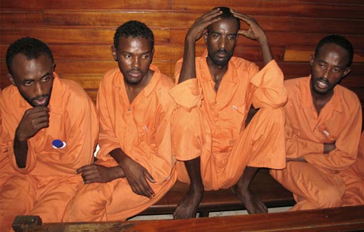 suspected Somali pirates sit in a court of law in Kenyan coastal town of Mombasa