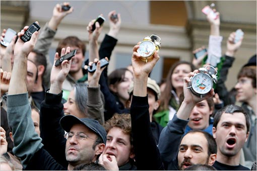 To signal that time is running out for a warming planet, French activists clutched alarm clocks and mobile phones at a protest at the Bourse, the former stock exchange in central Paris.