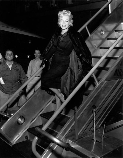Marilyn photographed arriving back in Hollywood before a press conference in the airport lounge, February 25, 1956